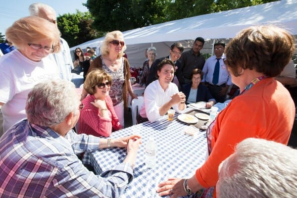 Justin and Arnold Chan, Liberal candidate for Scarborough—Agincourt, meet constituents at the St. Nicholas Greek Festival. June 15, 2014.