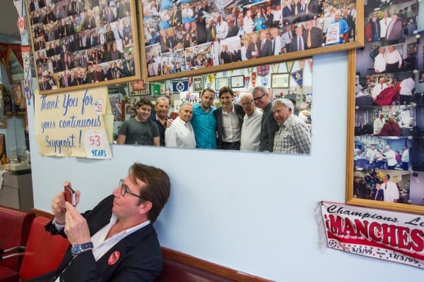 Scott Brison helps snap a photo as Justin and Adam Vaughan meet constituents in Trinity—Spadina. June 16, 2014.