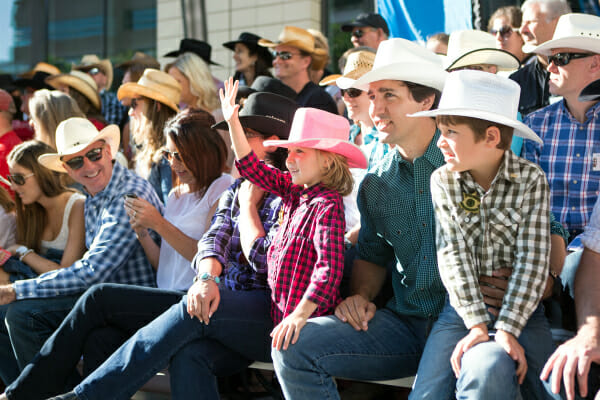 Justin Trudeau, Xavier, and Ella-Grace watch the opening parade at the 2014 Calgary Stampede. July 4, 2014.